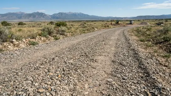 Professionally improved gravel driveway providing rural property access in Costilla County Colorado