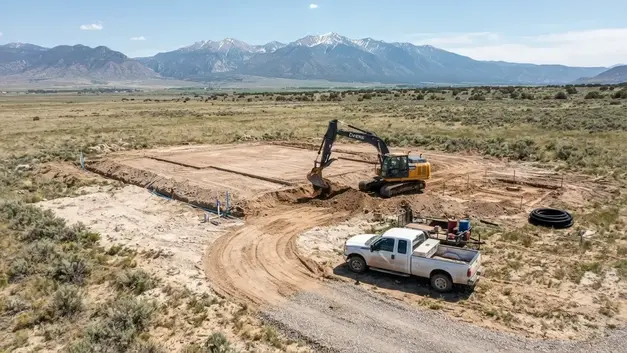 Rural Costilla County homesite with house pad, utility trenching, water infrastructure, and septic planning coordinated across the property