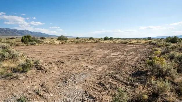 Selectively cleared rural Costilla County property prepared for a future homesite and access